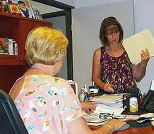 Barb pictured here doing a work place wellness evaluation